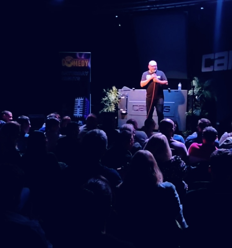 Stand-up comedian mid-performance at Jaggers Comedy Club Saturday night show