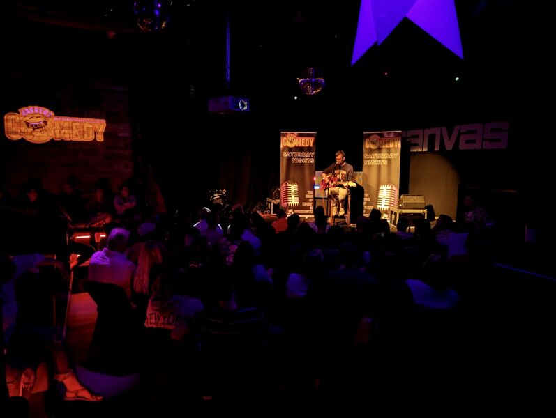 Packed audience laughing at Saturday night comedy show in Bournemouth